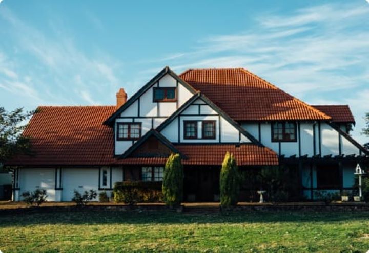 Is my house part of my pension? | A large countryside house with white walls, wood beans and a red tiled roof