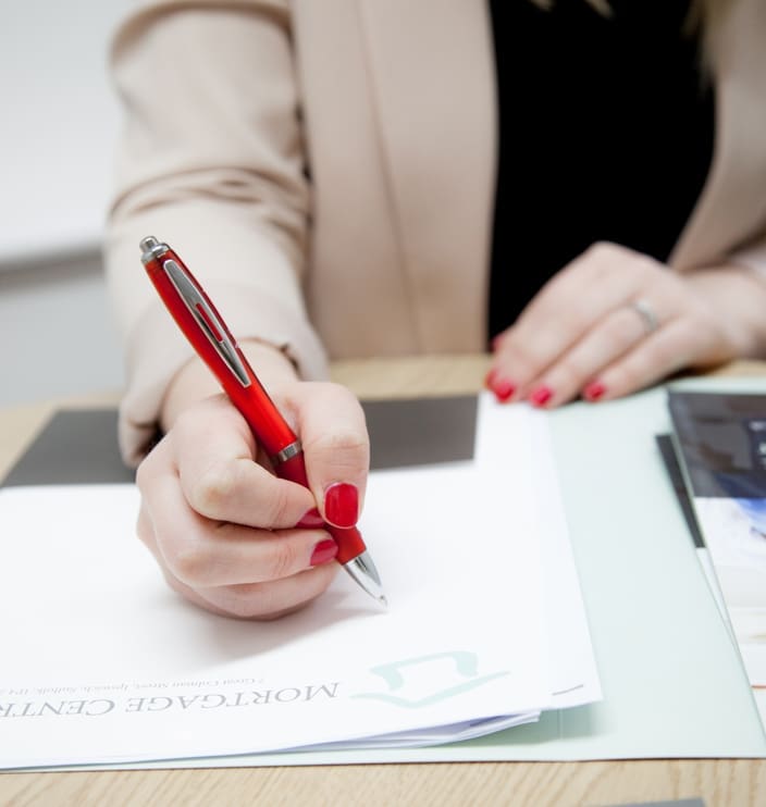 Mortgage Broker signing paperwork