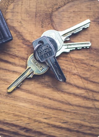 Secured loans | A set of keys on a wooden surface